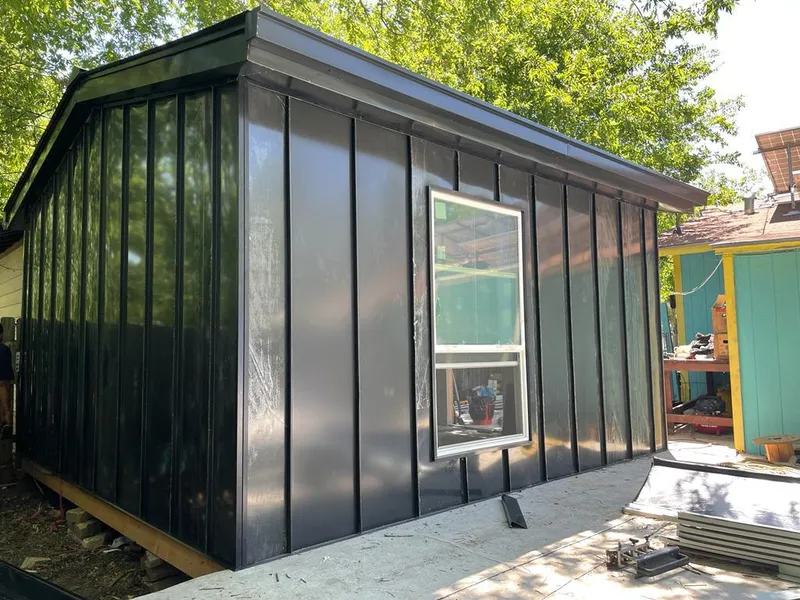 Black standing seam metal wall panels for Roof Inspection in Colton